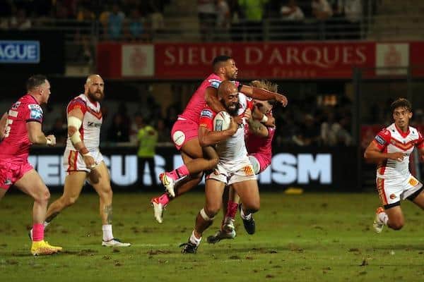 Kruise Leeming tackles Sam Kasiano during Rhinos' play-off win at Catalans. Picture by Manuel Blondeau/SWpix.com.