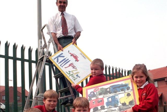 Ebor Gardens Primary School headteacher David Shipley is handed a speed limit sign by his pupils in May 1998.
