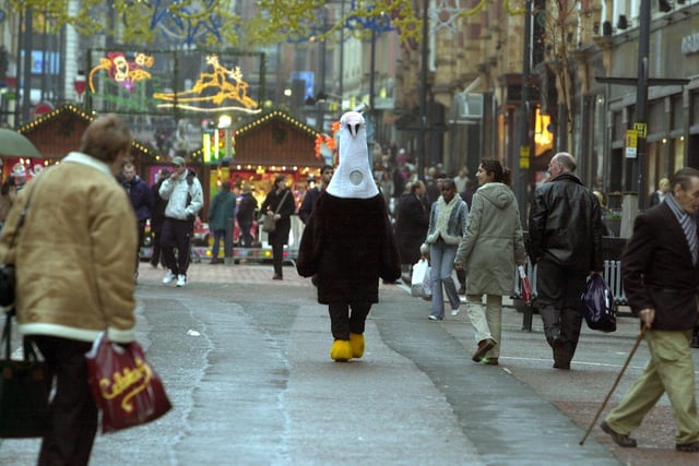 Out of This World shop in Leeds city centre, which is selling free range turkey's this Christmas despite the staff being vegetarian. Pictured is a 7ft Turkey, walking alone Briggate, Leeds, on December 3, 2003.
