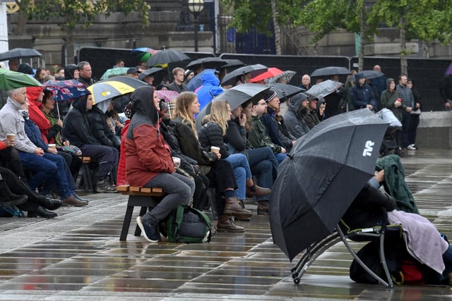 Mourners braved the rain as they watched events at Westminster Abbey unfold on the big screen