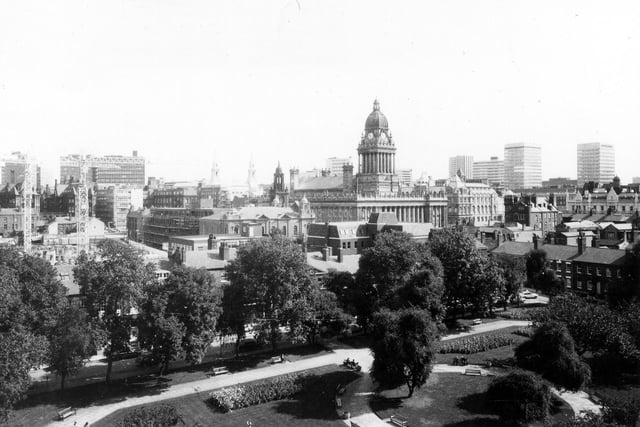 A view from August 1979 looking across from Park Square, with its neatly laid out paths, grassed areas, flower beds and trees, towards the city centre, where the Town Hall is prominent in the middle of the picture. Also visible is Oxford Place Chapel, to the left of the Town Hall, and next to this the construction of the new Leeds Combined Court Centre is taking place.