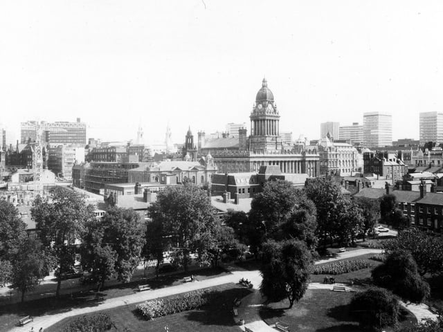 A view from August 1979 looking across from Park Square, with its neatly laid out paths, grassed areas, flower beds and trees, towards the city centre, where the Town Hall is prominent in the middle of the picture. Also visible is Oxford Place Chapel, to the left of the Town Hall, and next to this the construction of the new Leeds Combined Court Centre is taking place.