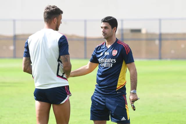 BACK IN TRAINING: Ben White with Arsenal boss Mikel Arteta at the Al Nasr Leisure Land Stadium in Dubai. Photo by Stuart MacFarlane/Arsenal FC via Getty Images.
