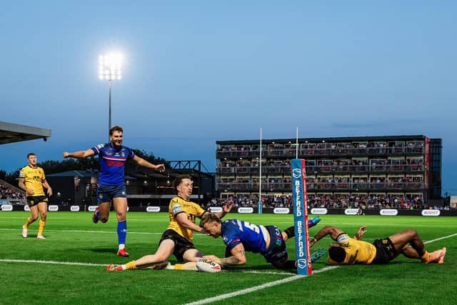 Tom Johnstone touches down for his second try in Wakefield Trinity's 52-14 hammering of Castleford Tigers. Picture by Alex Whitehead/SWpix.com.