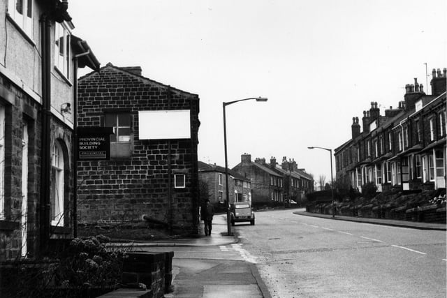 Looking up Woodhall Road in Calverley in February 1984. On the left is Brian Fleming Estate Agents, the local agents for the National & Provincial Building Society. The junction with Rushton Street follows.