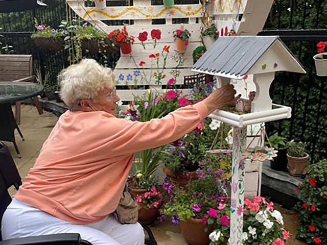 Resident Molly Hardwick gardening at HC-One’s Snapethorpe Hall Care Home gardening