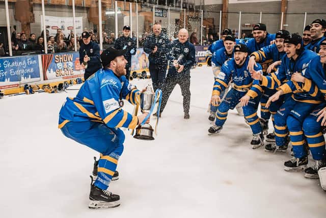 PARTY TIME: Matt Haywood lifts the NIHL National league trophy for the third straight year at Leeds Knights. Picture: Rob Halls/Knights Media.