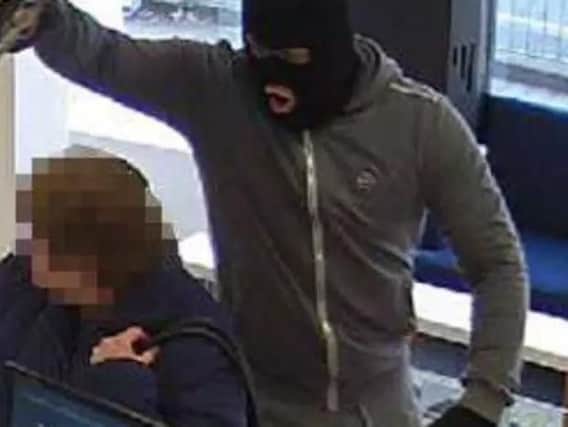 A CCTV image released of an armed robbery at gunpoint