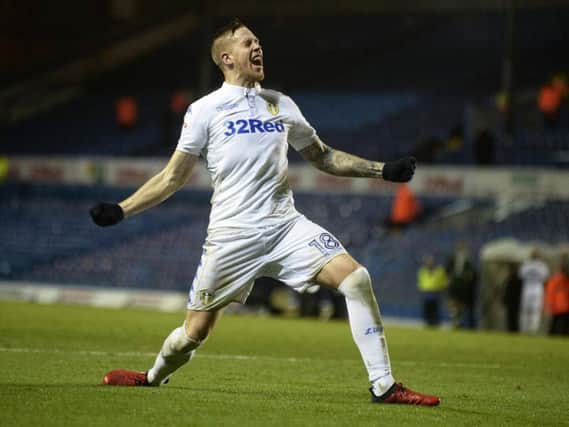 Pontus Jansson joins the Elland Road crowd in celebration following the match