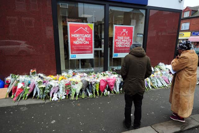 People stopping in Harehills this morning to pay their respects at the scene.