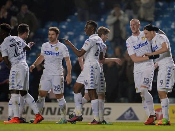 Chris Wood is joined by his Leeds teammates after netting the opener
