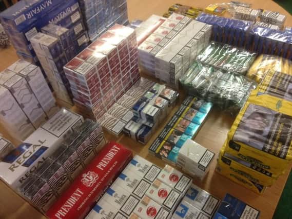 This haul of illegal cigarettes was found inside two cars searched by police.