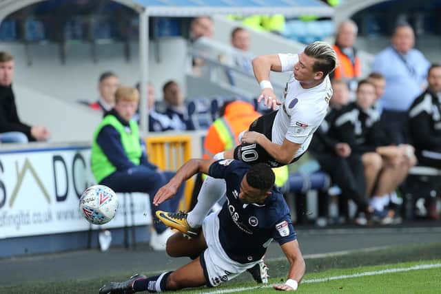 Millwall's James Meredith slides into a tackle on Gjanni Alioski during Leeds United's 1-0 defeat to the New Den last season.