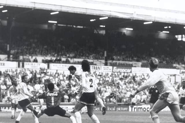 Gary Speed heads through a crowded goalmouth to beat goalkeeper Ricardo da Cruz and put the Whites ahead.