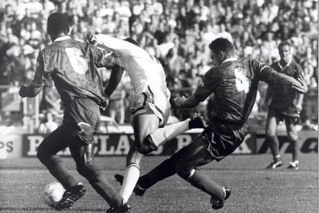 Gary Speed is chopped down by Vinnie Jones at Stamford Bridge. A Carl Shutt strike earned Leeds United all three points.