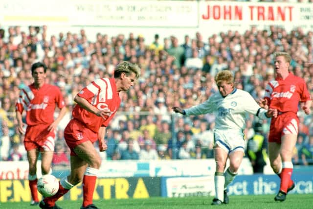 Gordon Strachan heads towards goal against the Reds at Elland Road
