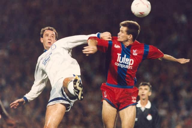 Gary McAllister in a duel for the ball before limping off injured.