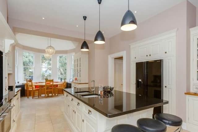 Large breakfast kitchen including bespoke kitchen cupboards, granite work surfaces, dual Siemens ovens, induction hob, integral microwave and American fridge freezer.