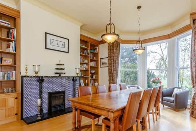 This boasts dual aspect windows and art deco fireplace.