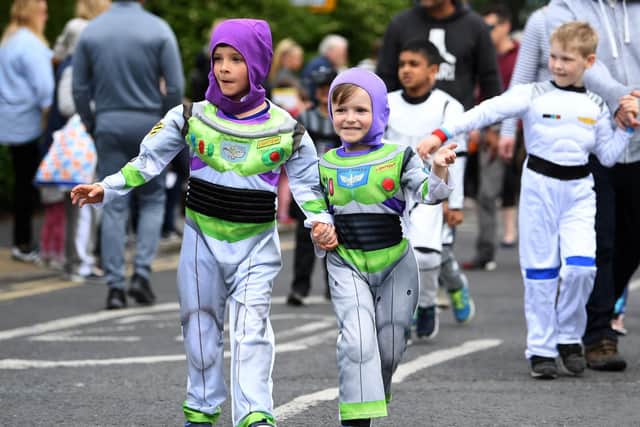 Two space invaders enjoying the parade.