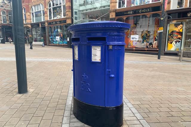 A post box on Briggate has been repainted blue