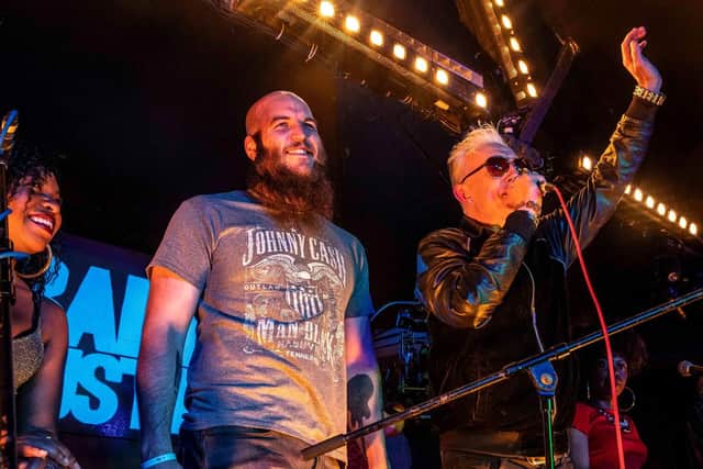 Ben Slack, 29, joining his favourite band Alabama 3 on stage.