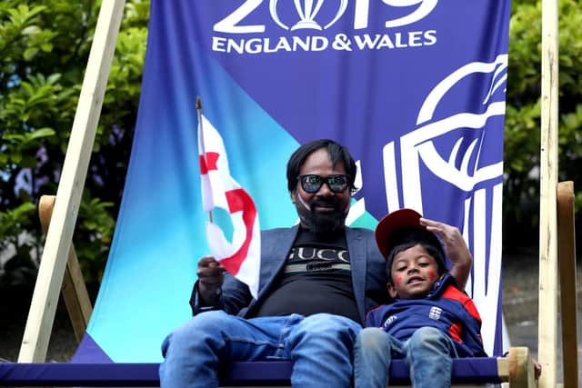 England fans sit in an oversized deck chair.