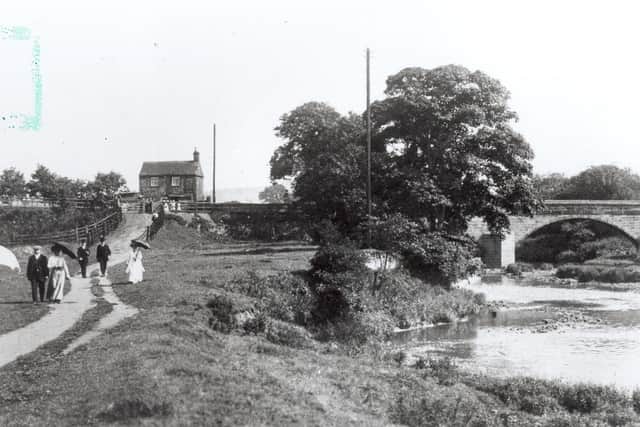 People enjoy a stroll by the Leeds and Liverpool Canal at Rodley. Excuse the green mark in the corner of the photo.