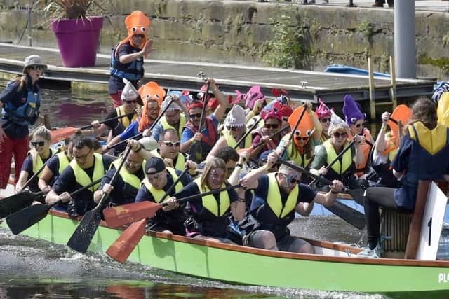 One of the first teams taking part in the dragon boat races at Leeds Dock.