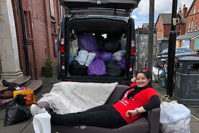 PhD student Claire-Hermine Ozber who is a volunteer for the Leave Leeds Tidy scheme, recycling rubbish left by students heading home for the summer.