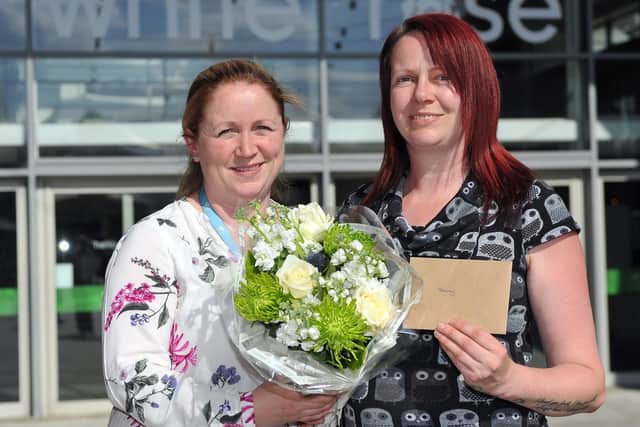 Nikki Appleton, marketing manager of the White Rose Shopping Centre presents competition winner Bev Halliday with her 500 prize.