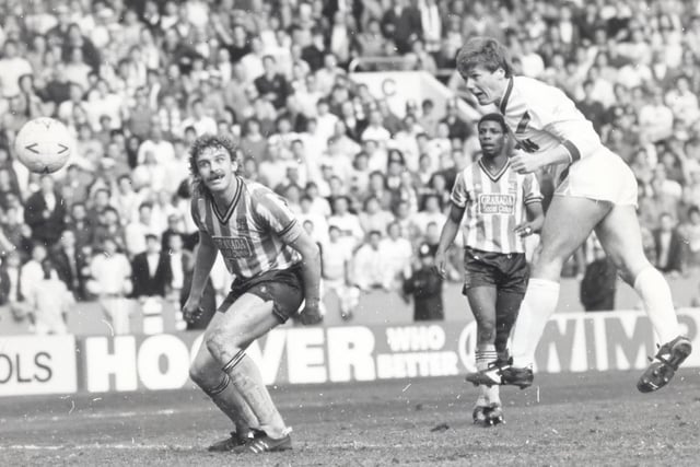Keith Edwards heads home for United as Sky Blues defender Brian Kilcline looks on.