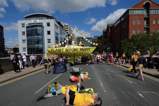 Protesters blocked the bridge by lying down in the middle of the road.