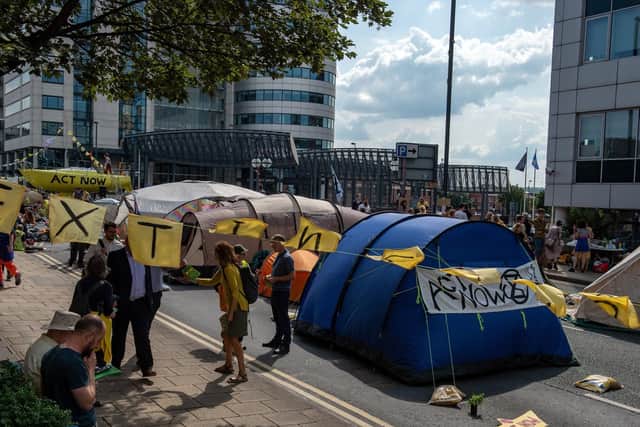 Protesters camped out overnight, keeping their hold on Victoria Bridge.