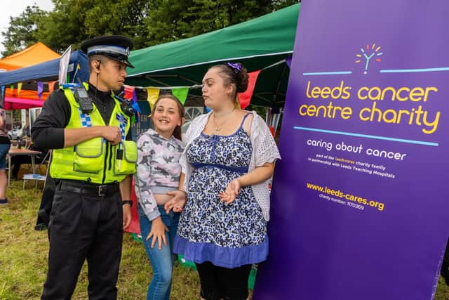PCSO Ali, chatting with Lacey Fryer, and Laura Keeling on the Leeds Cancer Centre Charity stand. Picture by James Hardisty.