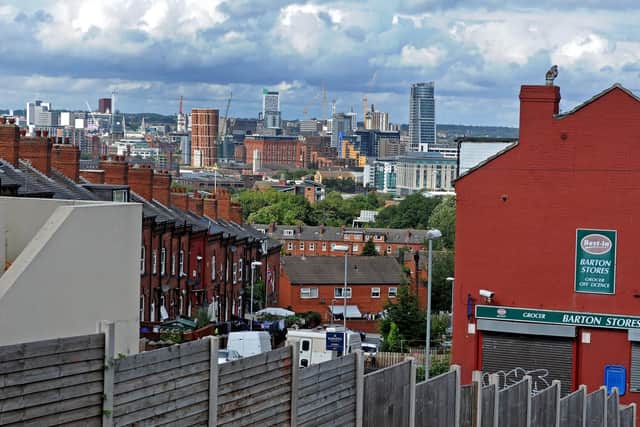 The booming Leeds city centre district in the Beeston background.