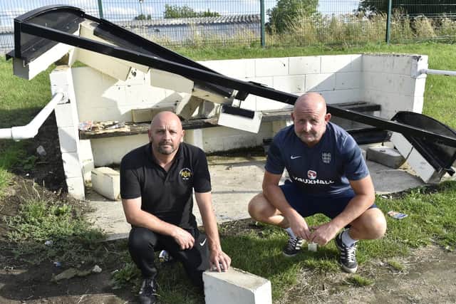 First team manager Mark Halmshaw and chairman Mally Hill by the vandalised dugout (Photo and video: Steve Riding)