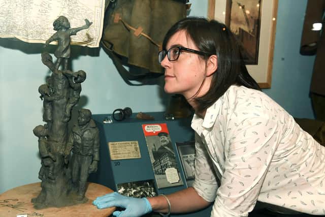 Exhibitions curator Ruth Martin views the maquette for the memorial statue of Arthur Louis Aaron, VC, sculpted by Graeme Ibbeson in 2001. Picture Jonathan Gawthorpe