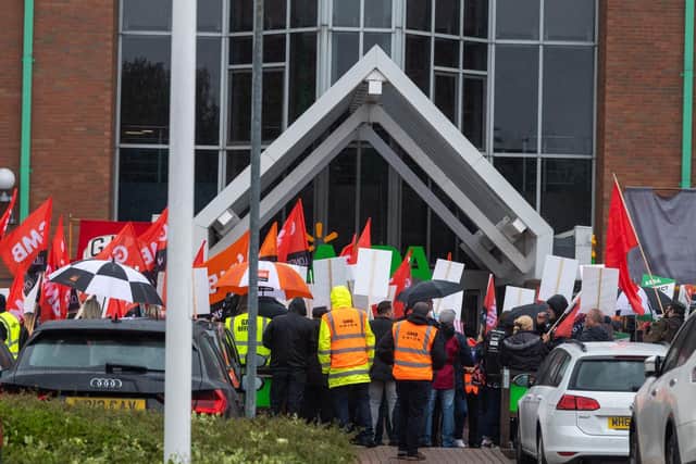 Protesters shouted 'shame on you' outside Asda House, the company's national headquarters.