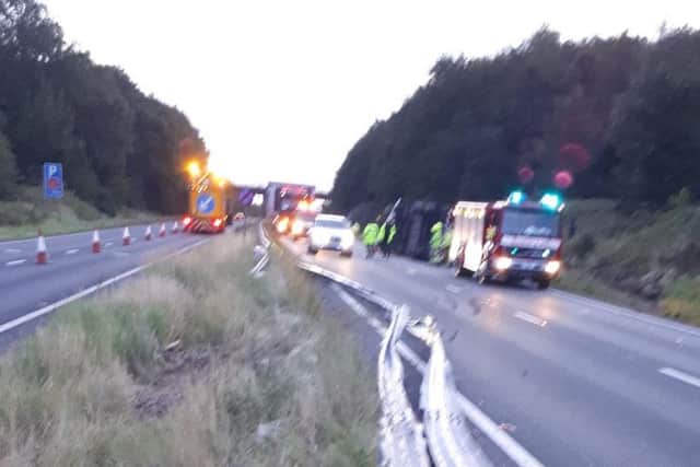 The overturned lorry is being recovered (Photo: Highways England)