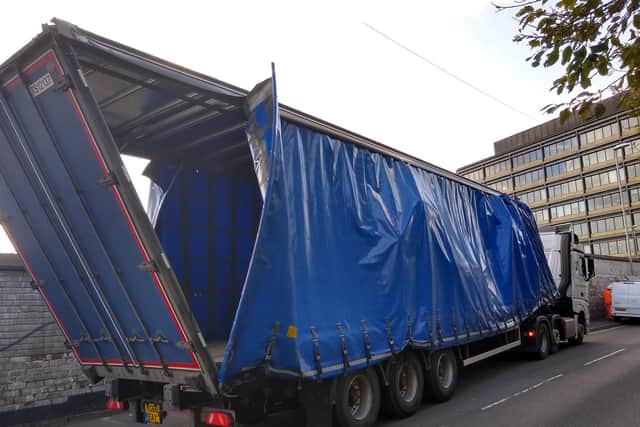 The impact ripped open the lorry trailer.