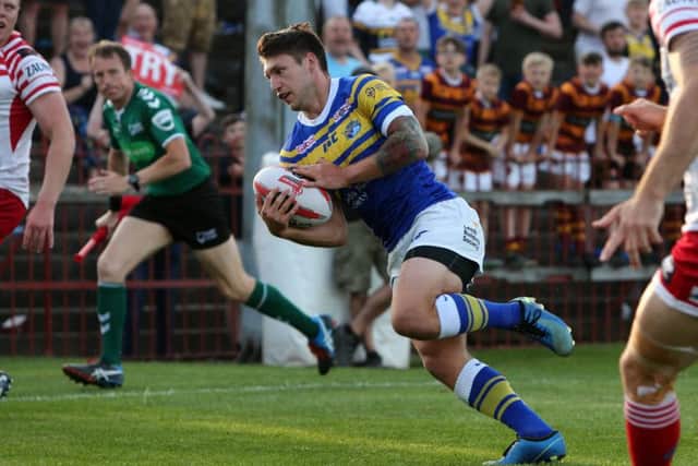 Leeds Rhinos' Tom Briscoe bursts through for a try against Leigh. 
Picture: Tom Banks/Varleys