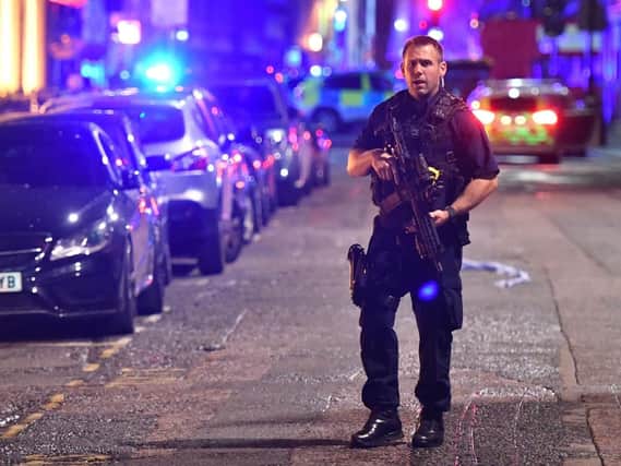 An armed police officer on the night of the London Bridge terrorist attack (Picture: Dominic Lipinski/PA Wire).