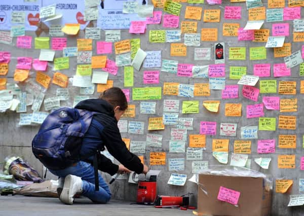 A young girl leaves a message on the first anniversary of the London Bridge terror attack.