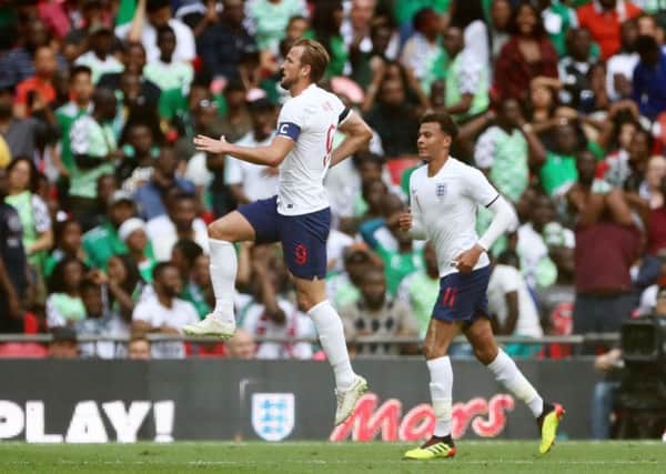 Get in: England's Harry Kane celebrates scoring his side's second goal against Nigeria.