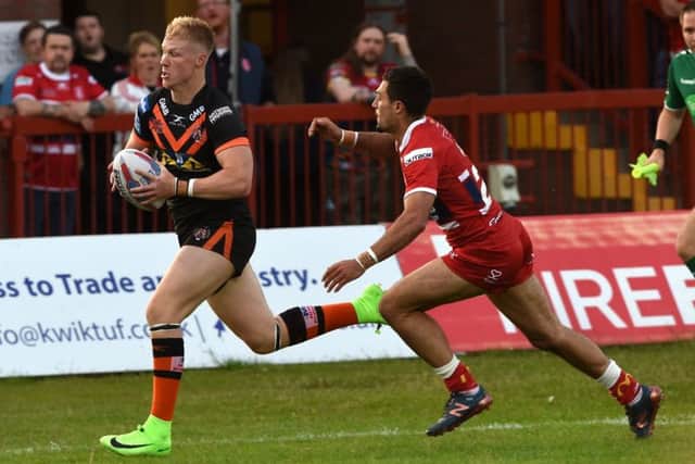 Kieran Gill on the charge for Castleford Tigers at Hull KR.