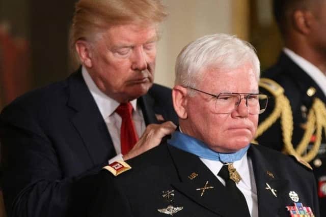 Captain Mike Rose receives the Medal of Honour from Donald Trump. Picture: Courtesy of Mike Rose.