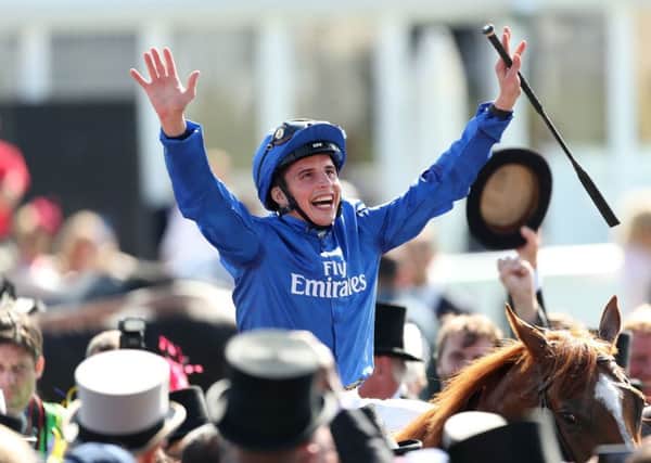 William Buick on Masar celebrates winning the Investec Derby. PIC: David Davies/PA Wire