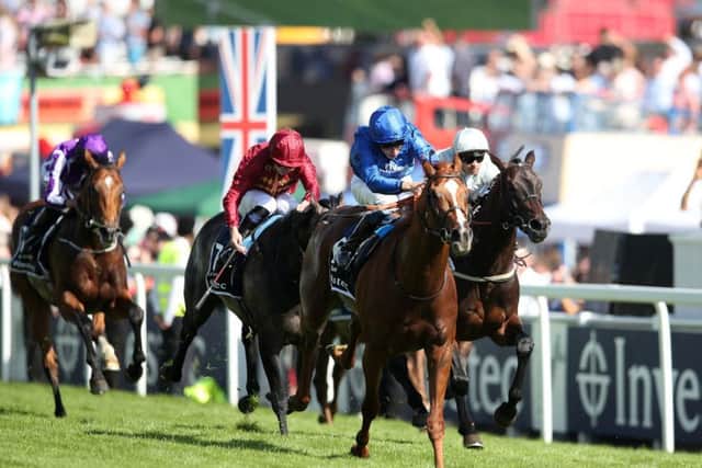 Masar ridden by jockey William Buick coming home to win the Investec Derby. PIC: Adam Davy/PA Wire