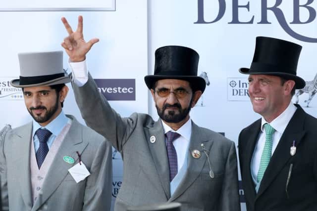 Hamdan bin Mohammed Al Maktoum (left), Mohammed bin Rashid Al Maktoum (centre) and Charlie Appleby after Masar won the Investec Derby. PIC: David Davies/PA Wire